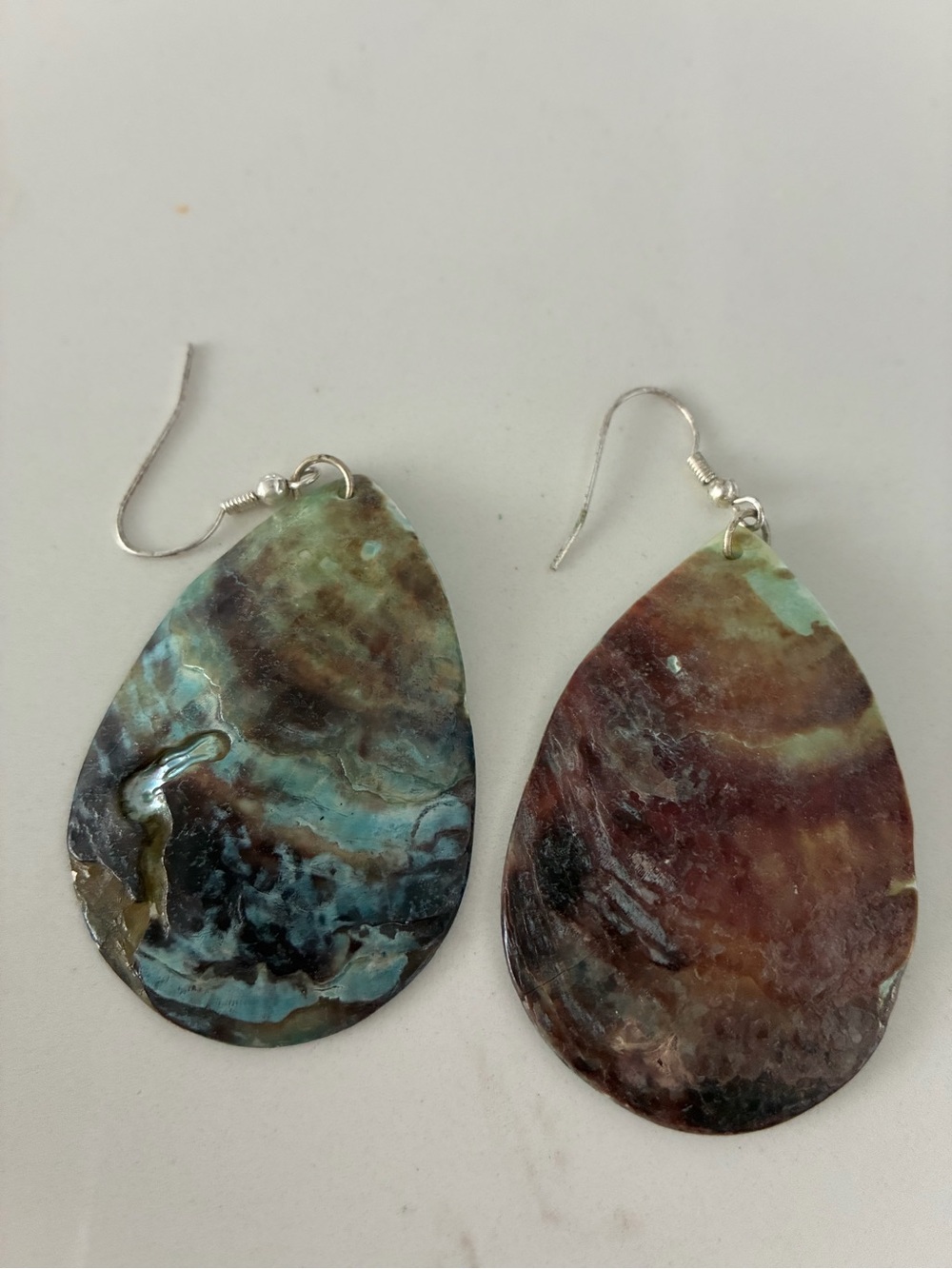 Natural Teardrop Earrings made of polished abalone shell .